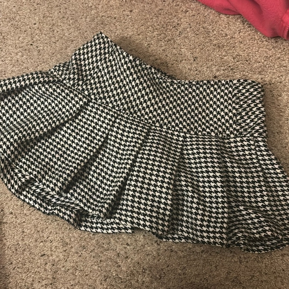 Cherokee mini skirt. size xs and has built in shorts under!